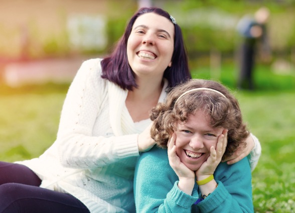 Mother and daughter smiling after visiting the special needs dentist