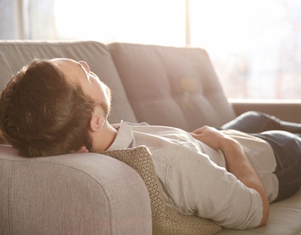 man resting after a tooth extraction   