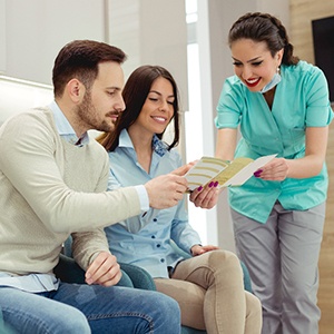 A patient paying the cost of a tooth extraction