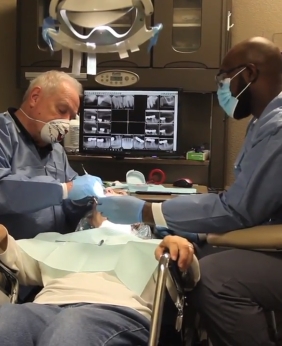 Special needs dentist treating dental patient