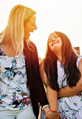 Woman and her loved one with special needs enjoying time outdoors