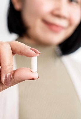 Dentist holding an oral conscious sedation pill