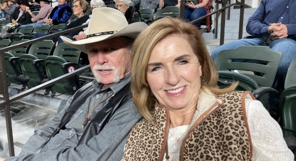 Doctor Ford and his wife at a sporting event