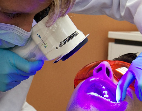 Patient receiving oral cancer screening