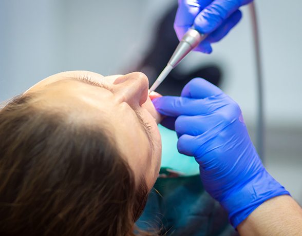 Patient receiving dental treatment under general anesthesia