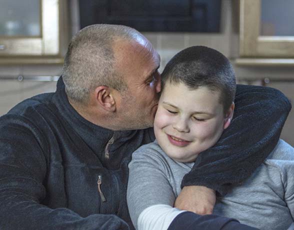 young boy with autism with his father