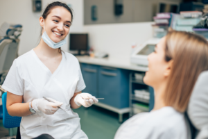a patient smiling while visiting the dentist
