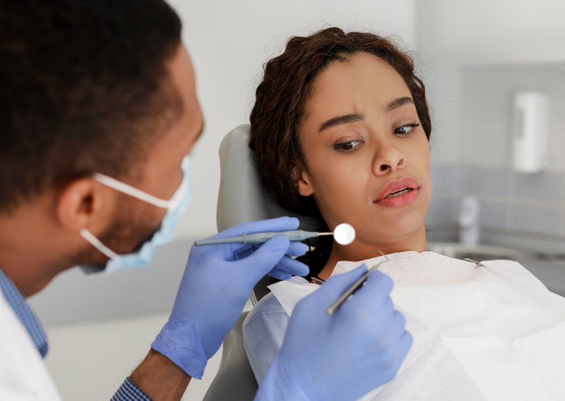 female patient nervous at the dentist’s office