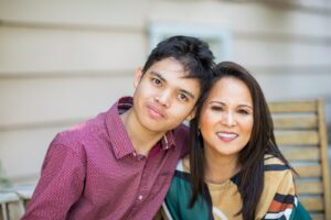 mother and son smiling together