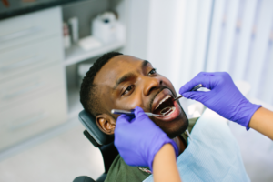 a dentist cleaning a patient's teeth